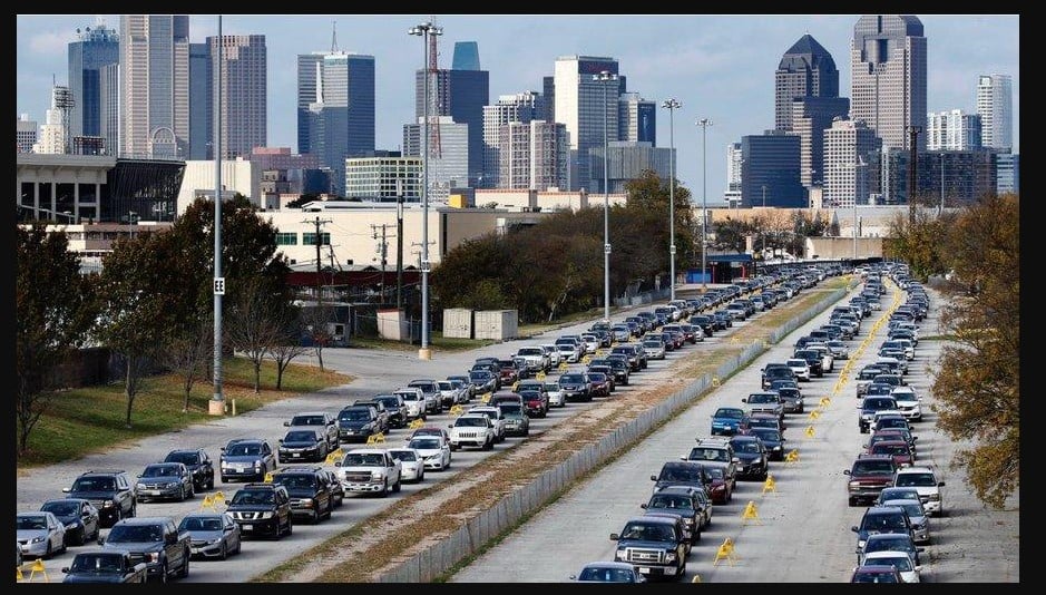 Thousands of cars lined up to collect food in Dallas, Texas, over the weekend, stretching as far as the eye can see.
